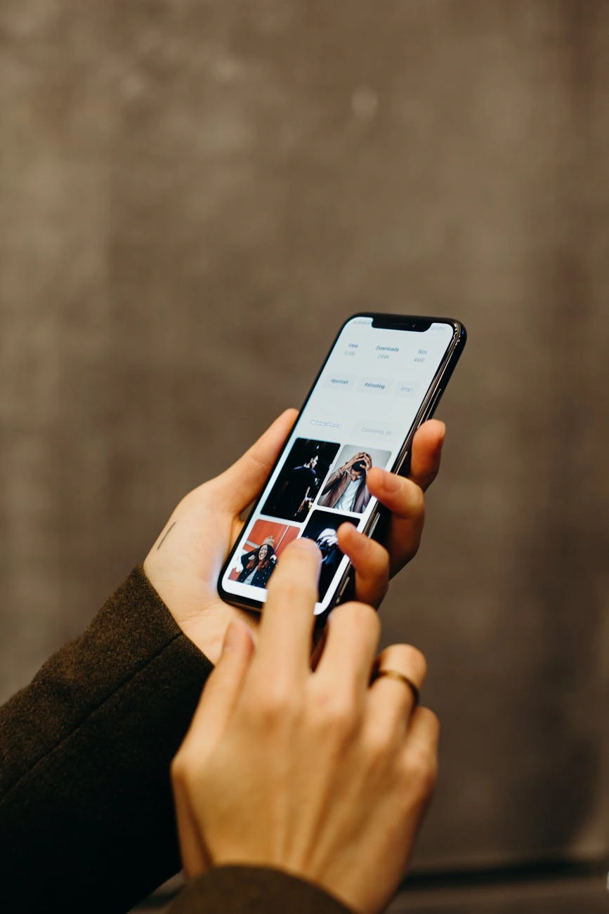 A hand holding a smartphone